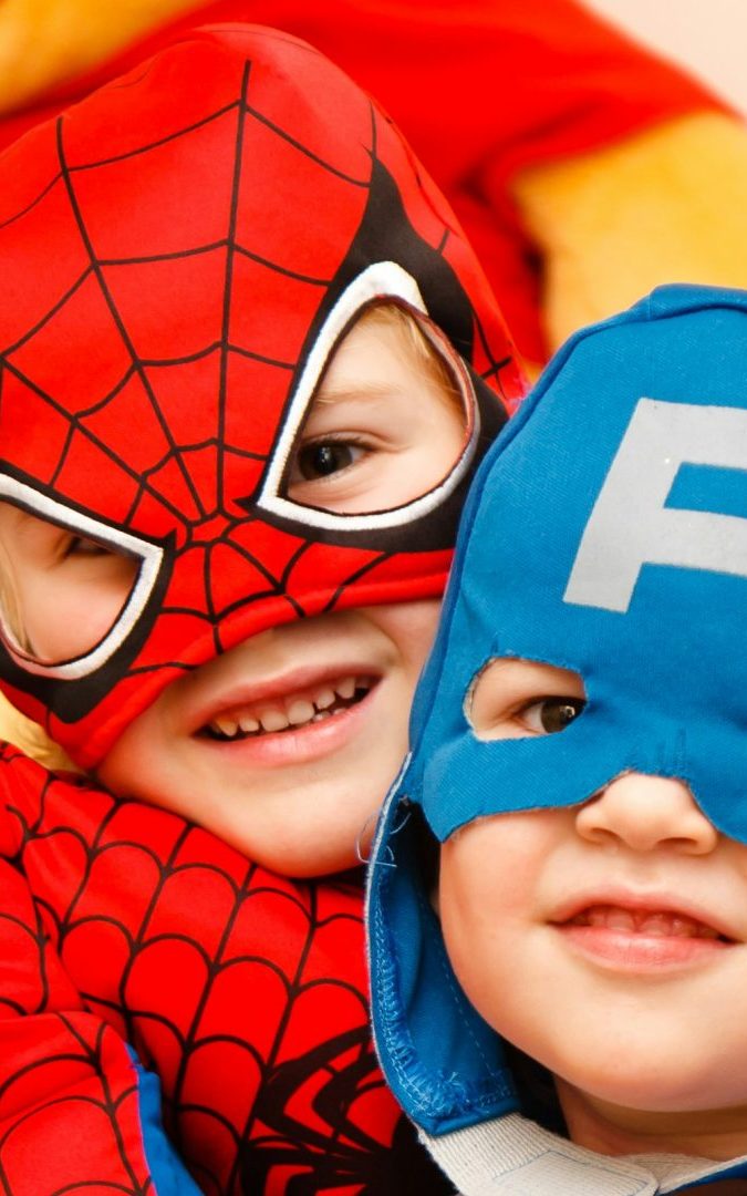 kids in spiderman and Captain America costumes